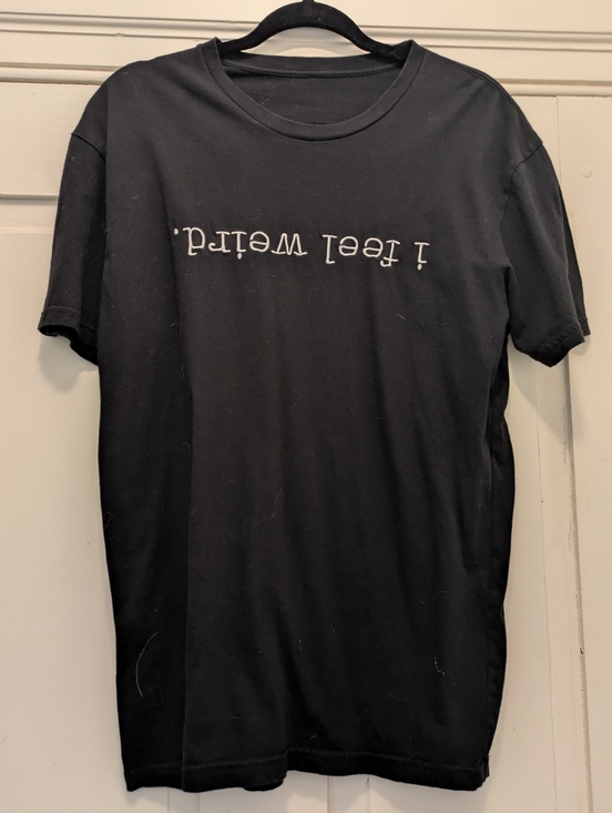 Tops - Black Graphic T Shirt- "I Feel Weird" (Upside Down)- M/L